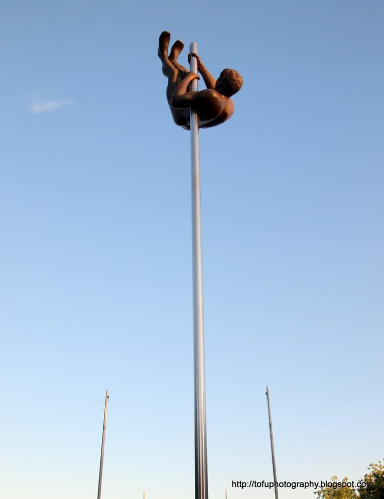 Raise your expectations, there is no bar! Pole vaulter statue.